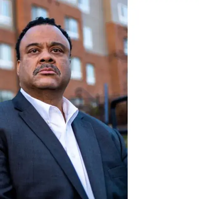 Man standing in front of a building