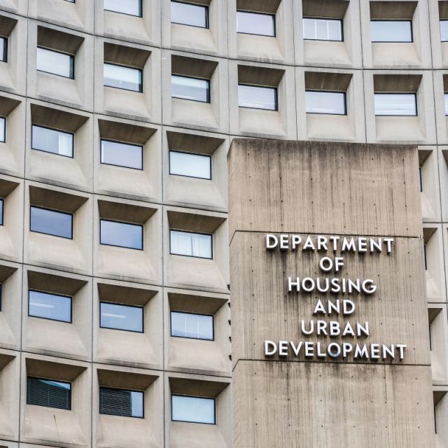 Grayish building with rows of windows with the word Department of Housing and Urban Development