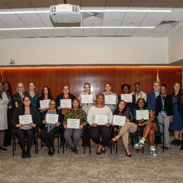 Housing Career Pathways trainees from Cohort Seven celebrate graduation with program partners.