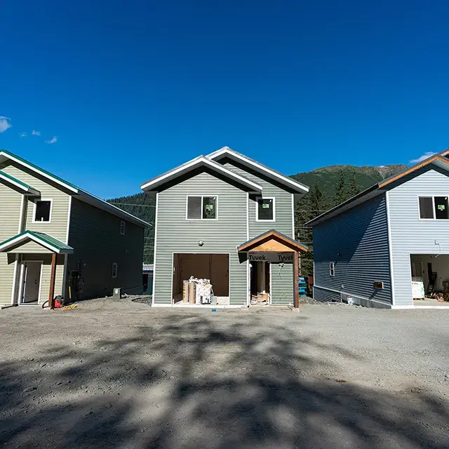 Three new homes being built side by side