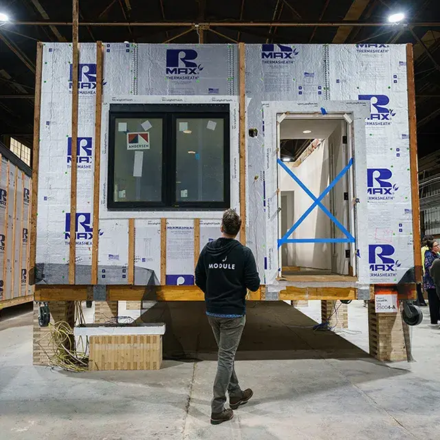 A person looking at the structure of a building