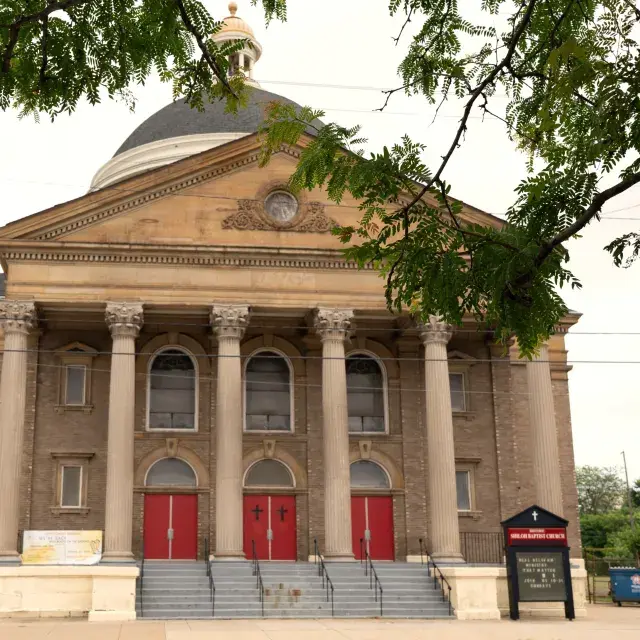 Streetview of the front entrance of Shiloh Baptist Church with trees framing the top of the image