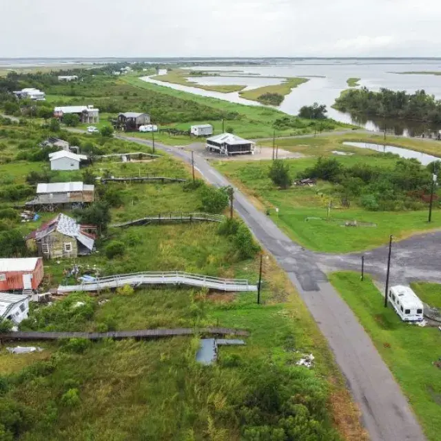 Aerial shot of a rural community showing homes and buildings destroyed