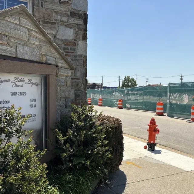 Church building located across from a housing development construction site