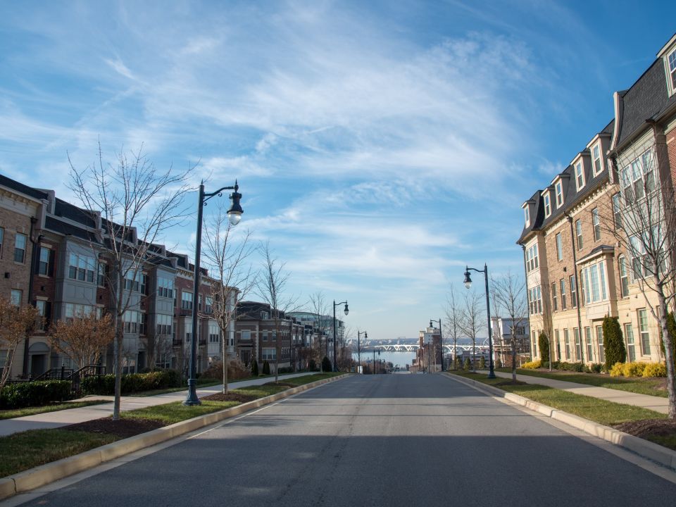 A city block with homes on block sides of the street.