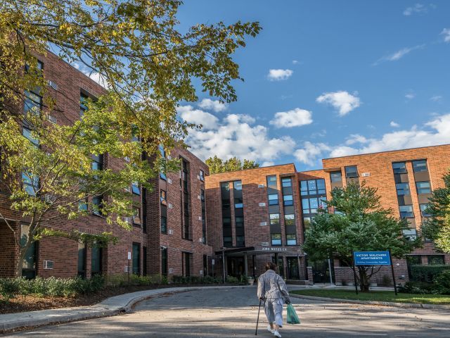 Chicago property woman walking towards building