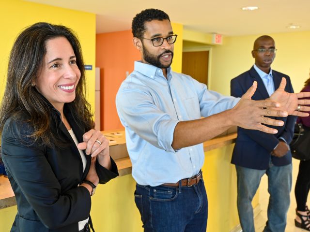 Priscilla Almodovar and Brian McLaughlin talking in a building