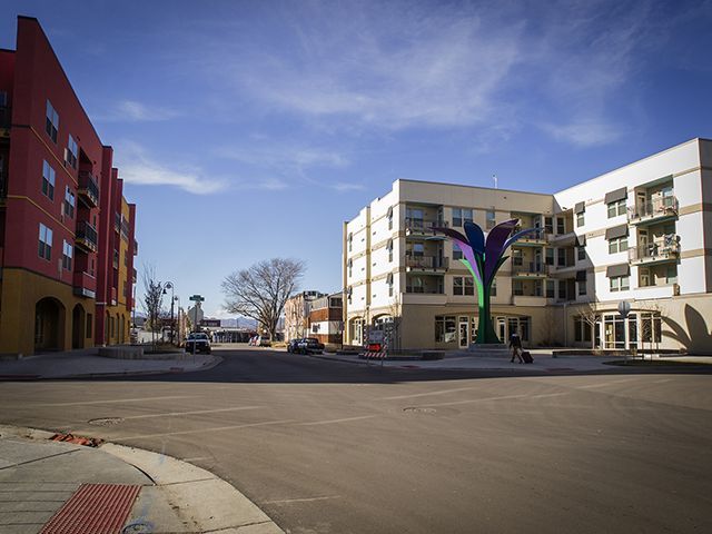 Two apartments buildings with a street between 