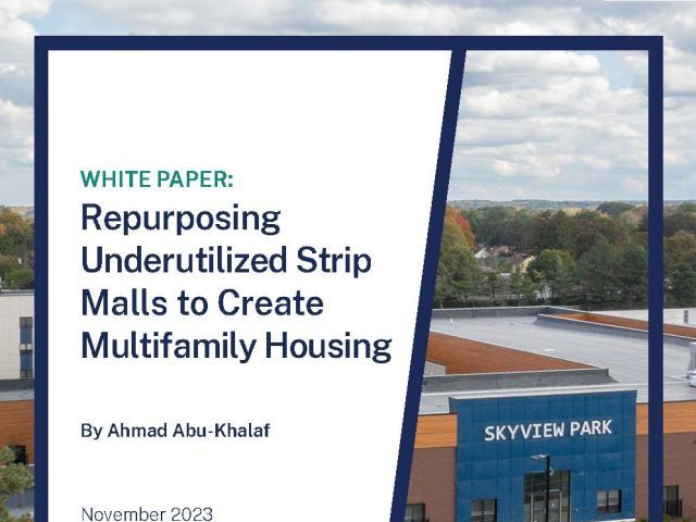 Repurposing Underutilized Strip Malls to Create Multifamily Housing and a parking lot in front of a store